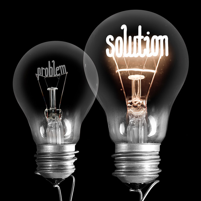 2 ampoules éclairées dont les filaments écrivent les mots probleme et solutions